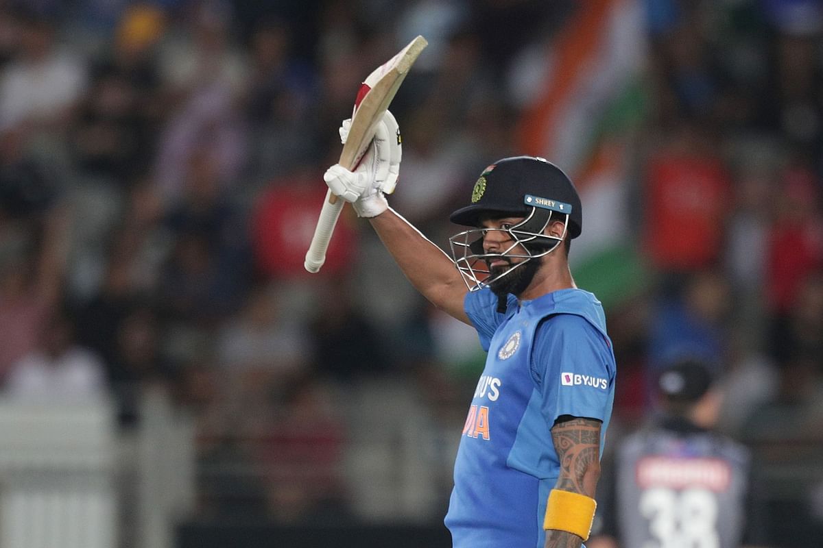 India’s wicketkeeper Lokesh Rahul raises his bat as he reacts after scoring half century (50 runs) during the second Twenty20 cricket match between New Zealand and India at Eden Park in Auckland on 26 January, 2020. Photo: AFP