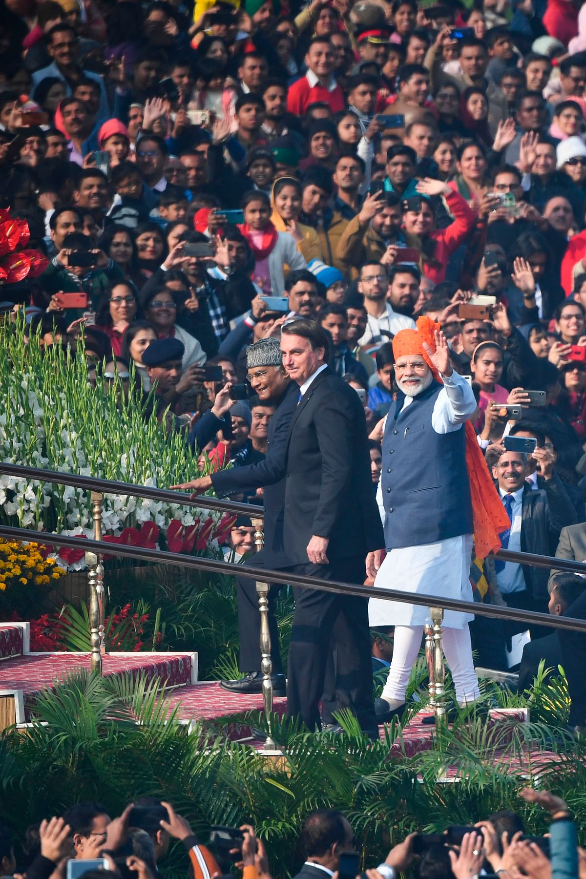 India`s prime minister Narendra Modi (R), President Ram Nath Kovind (L) and Brazil`s President Jair Bolsonaro (C) arrive to attend the Republic Day parade in New Delhi on 26 January 2020. Photo: AFP