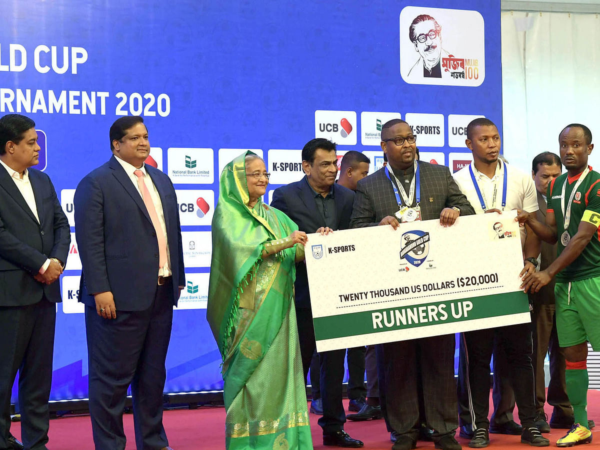 Bangladesh prime minister Sheikh Hasina hands over check to the Bangabandhu Gold Cup International Football Tournament-2020 runners-up Burundi at Bangabandhu National Stadium, Dhaka on 25 January 2020. Photo: PID