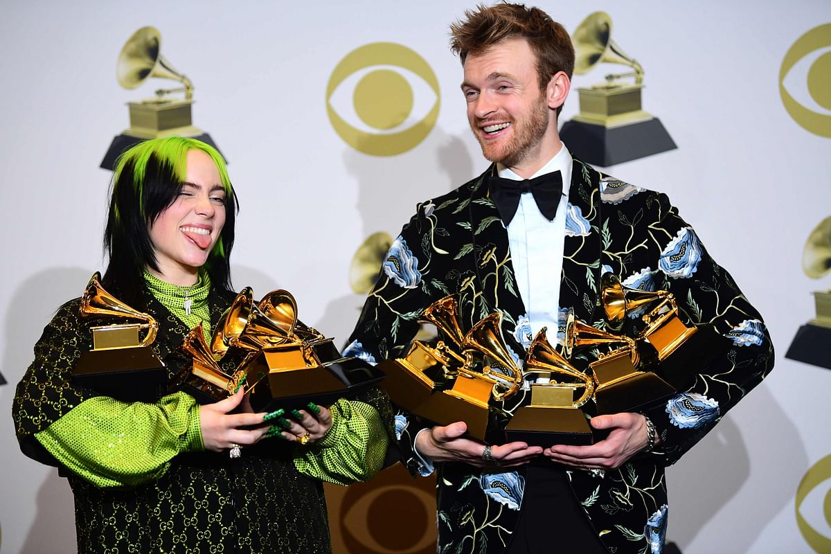 US singer-songwriter Billie Eilish (L) and Finneas O`Connell pose in the press room with the awards for Album Of The Year, Record Of The Year, Best New Artist, Song Of The Year and Best Pop Vocal Album during the 62nd Annual Grammy Awards on 26 January, 2020, in Los Angeles. Photo: AFP