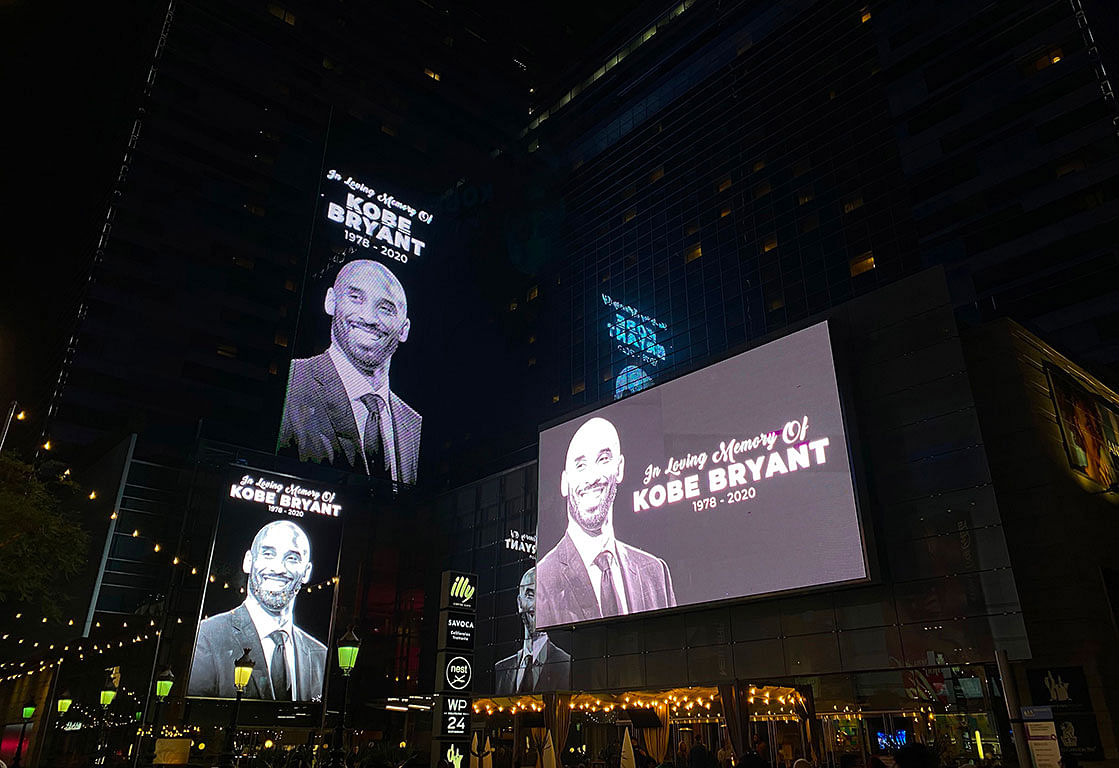 Buildings around the Staples Center display screens paying tribute to former NBA and Los Angeles Lakers player Kobe Bryant on 26 January, 2020 following his death in a helicopter crash near Los Angeles. Photo: AFP