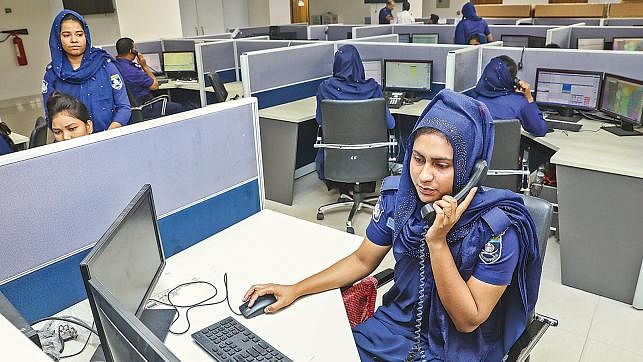 Policemen work at the control room of National Emergency Service, 999, at Abdul Ghani Road, Dhaka. Photo: Prothom Alo