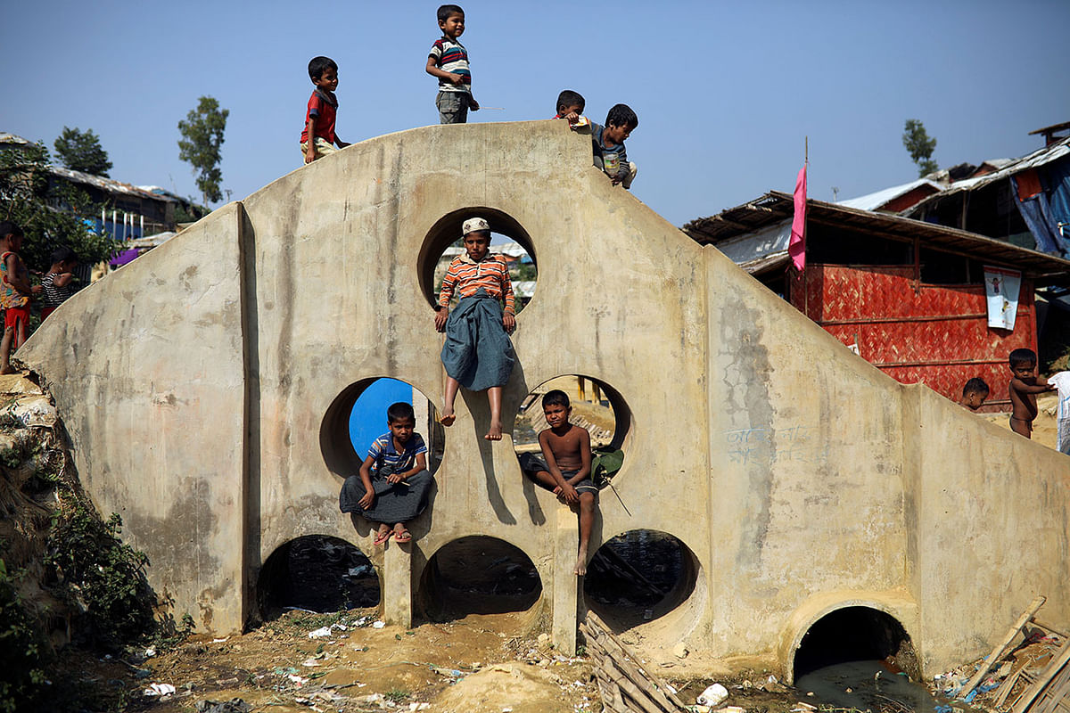 Rohingya refugee children play on a concrete structure at the Balukhali camp in Cox’s Bazar, Bangladesh, on 16 November 2018. Photo: Reuters