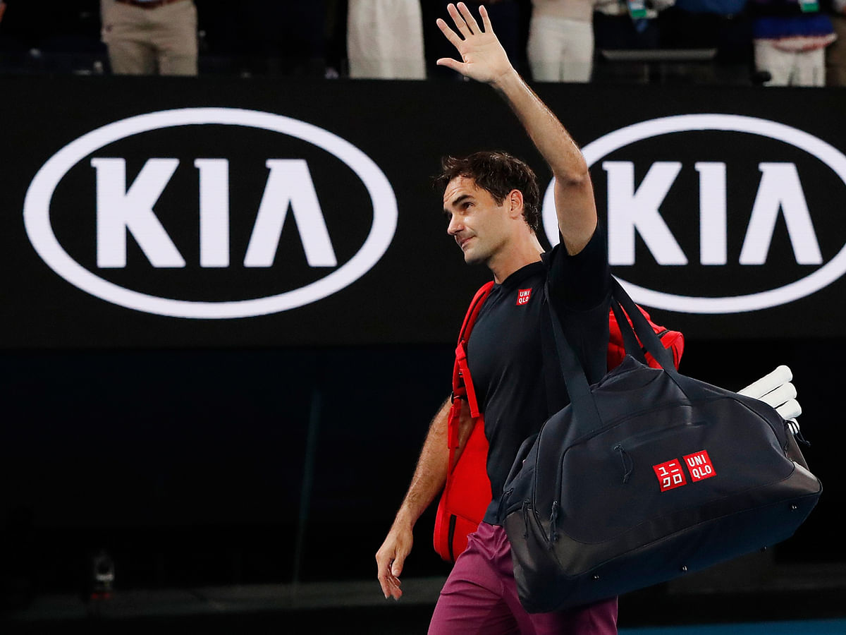 Switzerland`s Roger Federer waves as he leaves the court after his match against Serbia`s Novak Djokovic on 30 January, 2020. Photo: Reuters