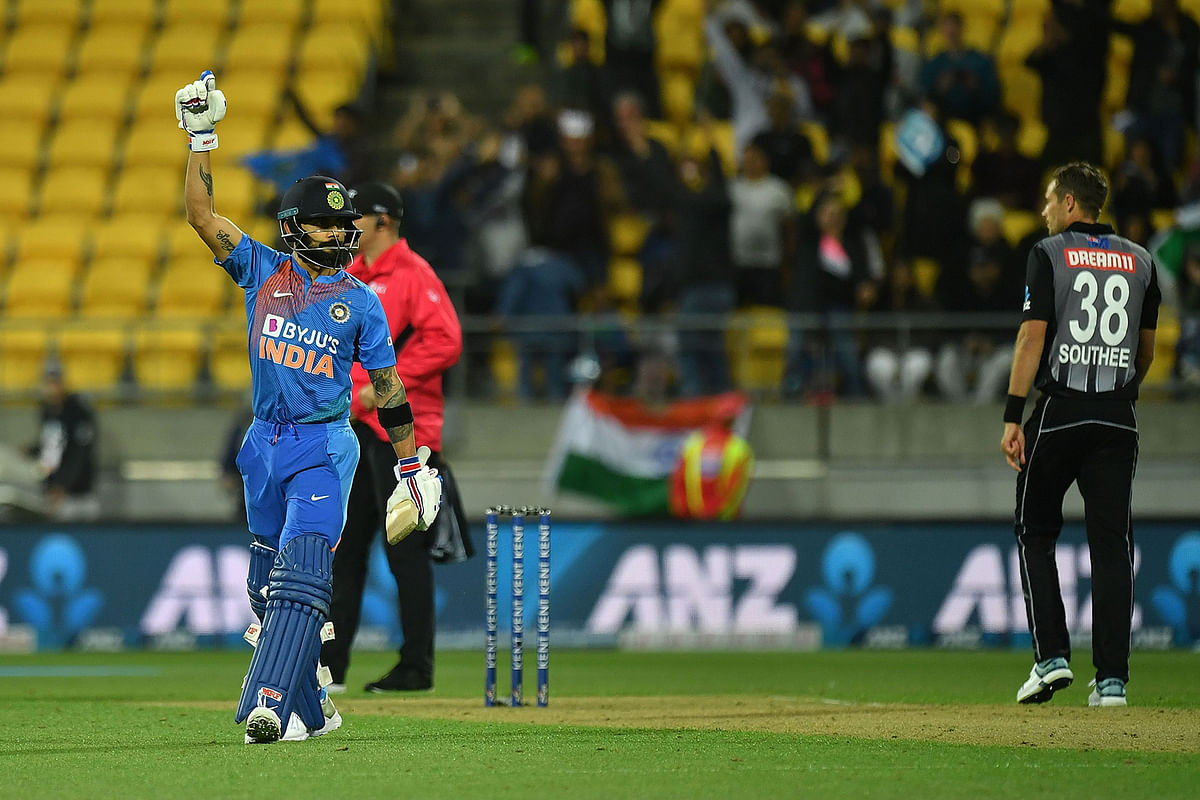 India`s captain Virat Kohli (L) celebrates win during the fourth Twenty20 international cricket match between New Zealand and India at Sky Stadium in Wellington on 31 January, 2020. Photo: AFP