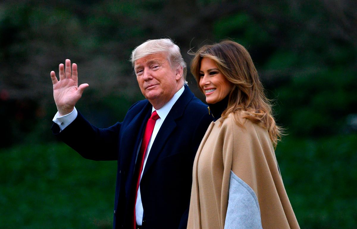 US President Donald Trump waves next to First Lady Melania Trump as they walk to Marine One before departing from the South Lawn of the White House in Washington, DC on 31 January 2020. Photo: AFP