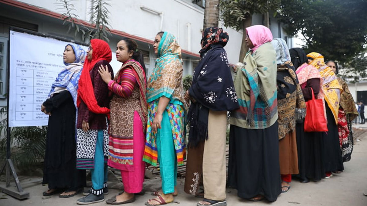 Women voters in a queue wait to cast their votes in the city corporation polls at Bakshibagh, Dhaka on 1 February 2020. Photo: Abdus Salam