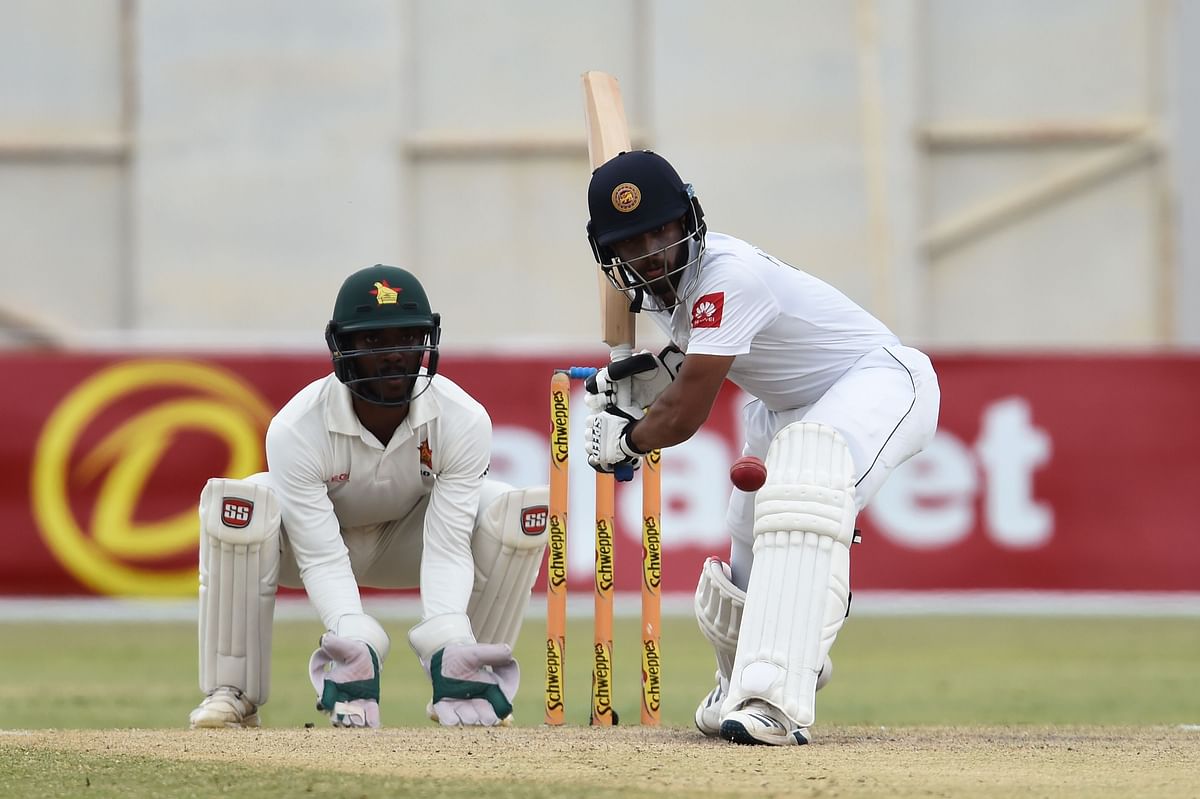 Sri Lanka`s Kusal Mendis (R) plays a shot as Zimbabwe`s Regis Chakabva (L) during the fifth day of the second Test cricket match between Zimbabwe and Sri Lanka at the Harare Sports Club in Harare on 31 January 2020. Photo: AFP