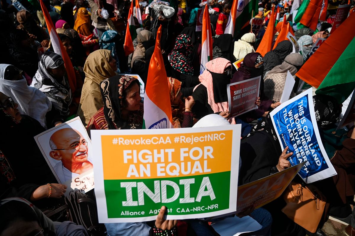 Protesters from Shaheen Bagh hold placards as they take part in a demonstration against India`s new citizenship law at Jantar Mantar, in New Delhi on 29 January 2020. Photo: AFP
