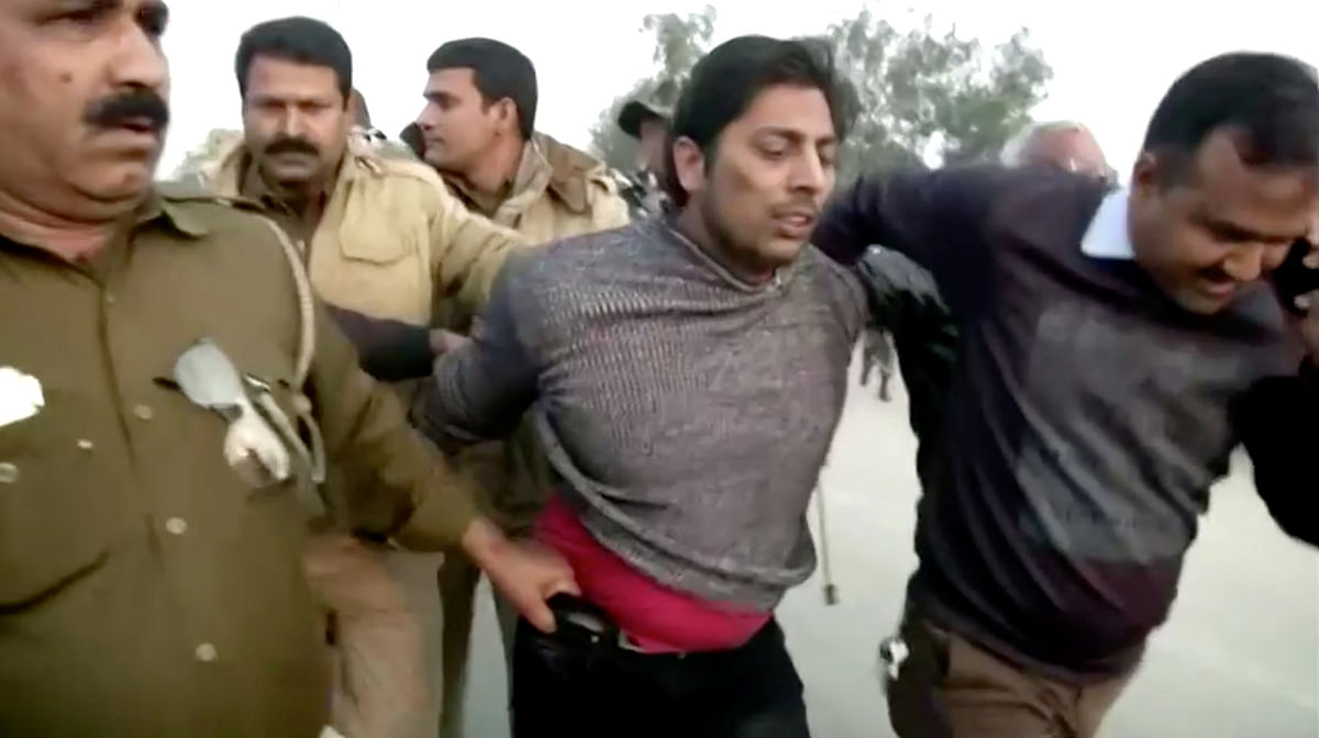 Police officers detain a man, who identified himself as Kapil Gujjar, who fired multiple shots at a site where people were protesting against a new citizenship law in New Delhi, India, on 1 February 2020, in this still image taken from video. Photo: Reuters