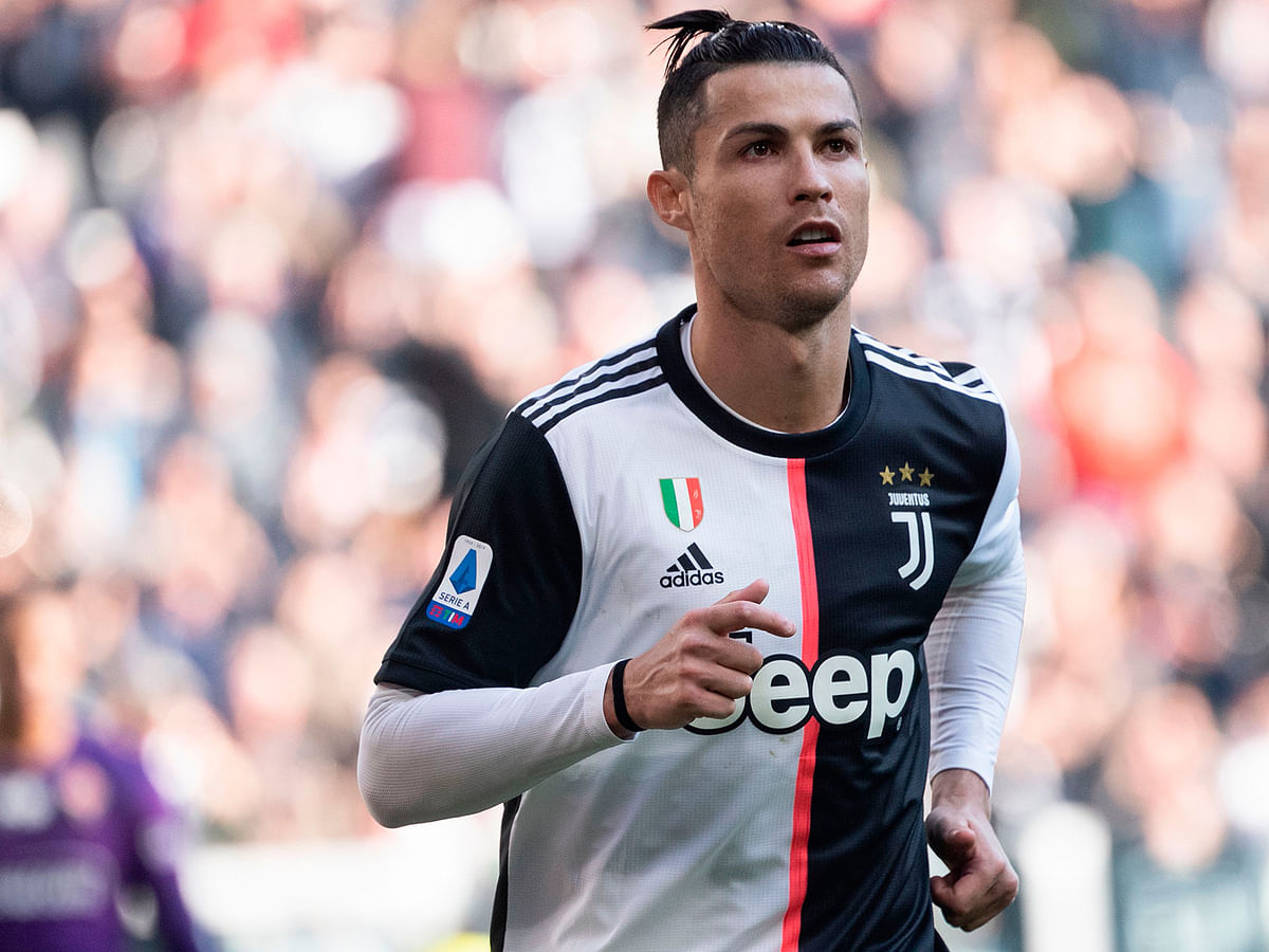 Juventus` Portuguese forward Cristiano Ronaldo celebrates after scoring his second penalty, and his 50th goal with Juventus, during the Italian Serie A football match Juventus vs Fiorentina on 2 February 2020 at the Juventus Allianz stadium in Turin. Photo: AFP