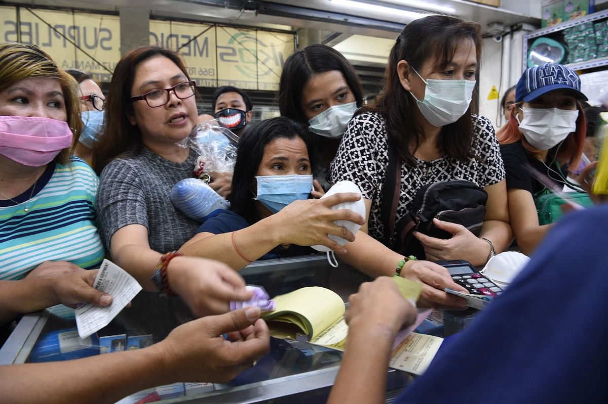 People buying protective masks at a medical supplies store in Manila on 31 January 2020. The Philippines reported its first case of the virus on 30 January of a 38-year-old woman who arrived from Wuhan and is no longer showing symptoms. Photo: AFP