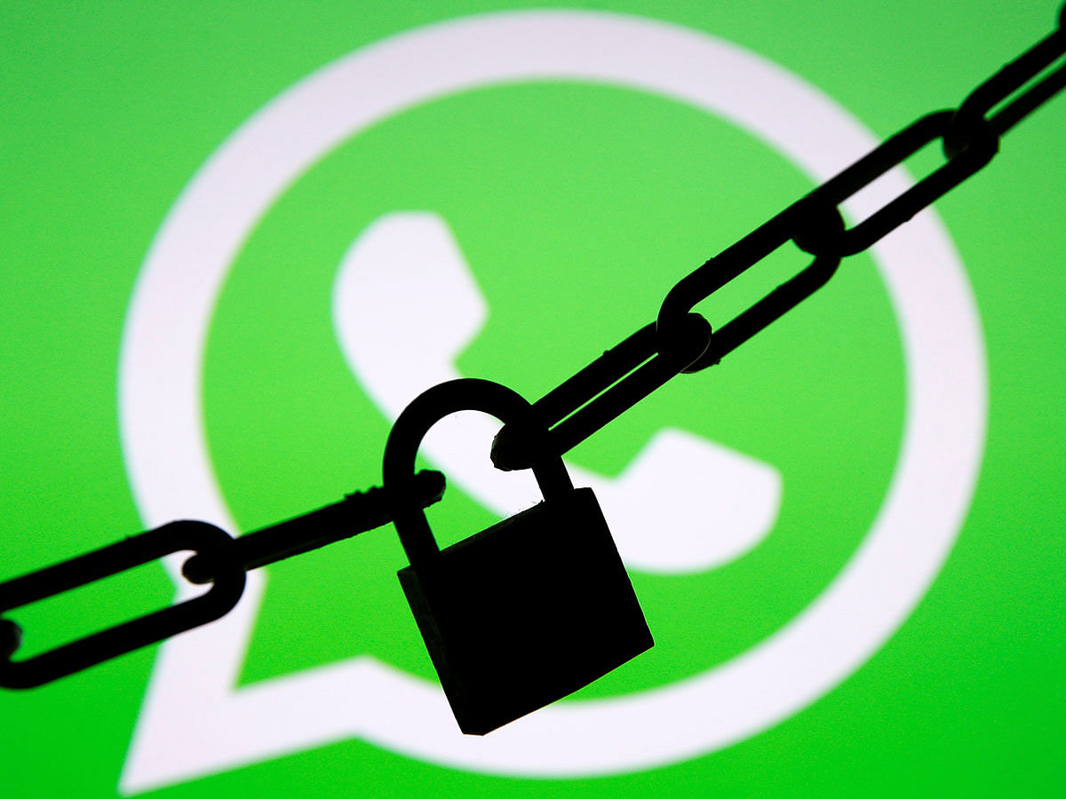 A photo illustration shows a chain and a padlock in front of a displayed Whatsapp logo on 13 January 2017. Reuters File Photo