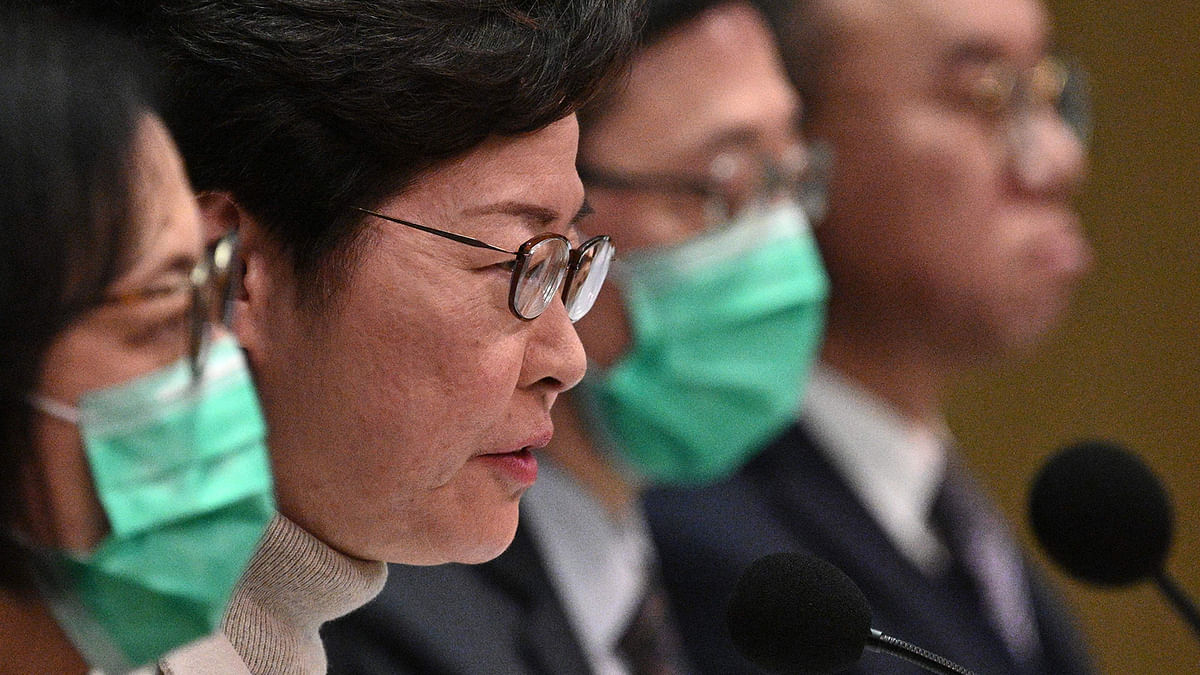 Hong Kong`s chief executive Carrie Lam (2nd L) speaks during a press conference in Hong Kong on 3 February, 2020. Photo: AFP