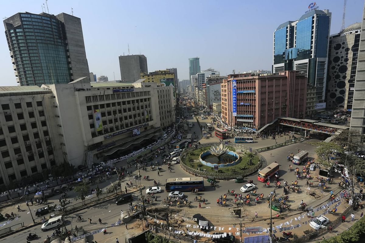 Vehicles ply along the Shapla Square in Matijheel, Dhaka on 2 February 2020 during the BNP enforced a daylong hartal (general strike) after the city corporation polls. Photo: Hasan Raja