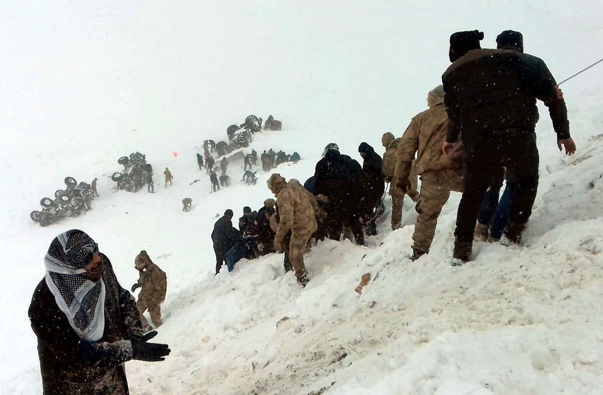Turkish soldiers and locals try to rescue people trapped under avalanche in Bahcesaray in Van province, Turkey, on 5 February 2020, in this still image taken from video. Photo: Reuters