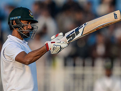 Bangladesh's Mohammad Mithun celebrates after scoring a half century (50 runs) during the first day of the first cricket Test match between Pakistan and Bangladesh at the Rawalpindi Cricket Stadium in Rawalpindi on 7 February, 2020. Photo: AFP