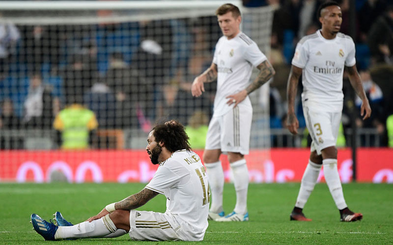 Real Madrid’s Brazilian defender Marcelo reacts to his team’s defeat sitting on the field during the Spanish Copa del Rey (King’s Cup) quarter-final football match Real Madrid CF against Real Sociedad at the Santiago Bernabeu stadium in Madrid on 6 February 2020. Photo: AFP