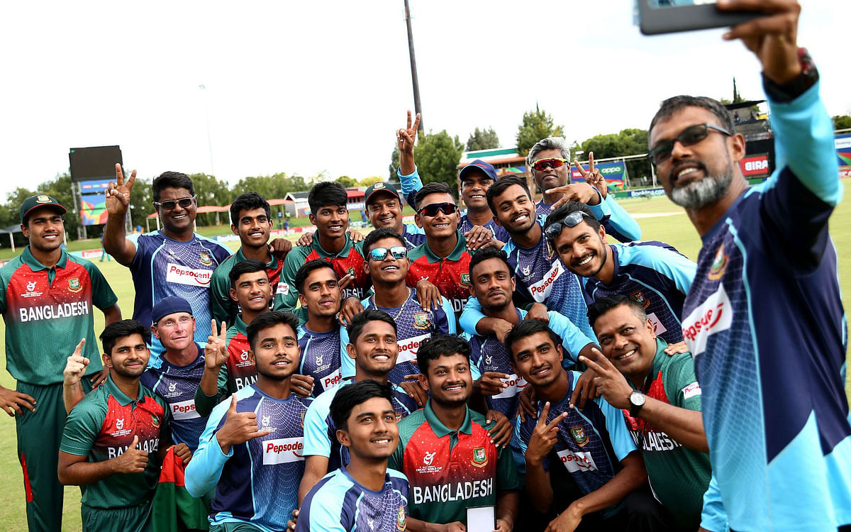 Bangladesh Under-19 players, coaching staff and officials celebrate after the win in the semi-final against New Zealand. Photo: Cricket World Cup Twitter Handle