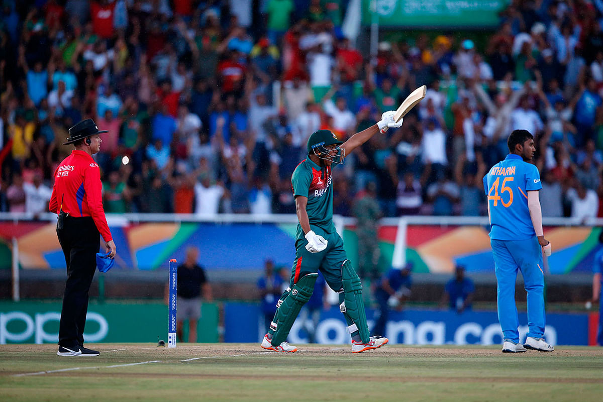 Bangladesh`s Rakibul Hasan (C) celebrates after scoring the winning runs as India`s Atharva Ankolekar and umpire Sam Nogajski (L) looks on at during the ICC Under-19 World Cup cricket finals between India and Bangladesh at the Senwes Park, in Potchefstroom, on 9 February, 2020. Photo: AFP