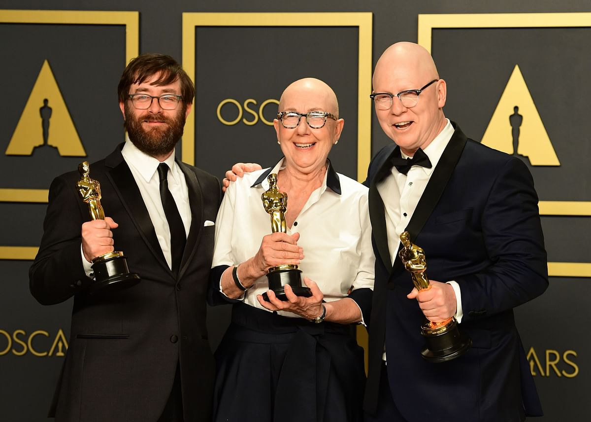 US directors Julia Reichert, Jeff Reichert (R) and steven Steven Bognar (L) pose in the press room with the Oscar for Best Documentary Feature for `American Factory` during the 92nd Oscars at the Dolby Theater in Hollywood, California on 9 February, 2020. Photo: AFP