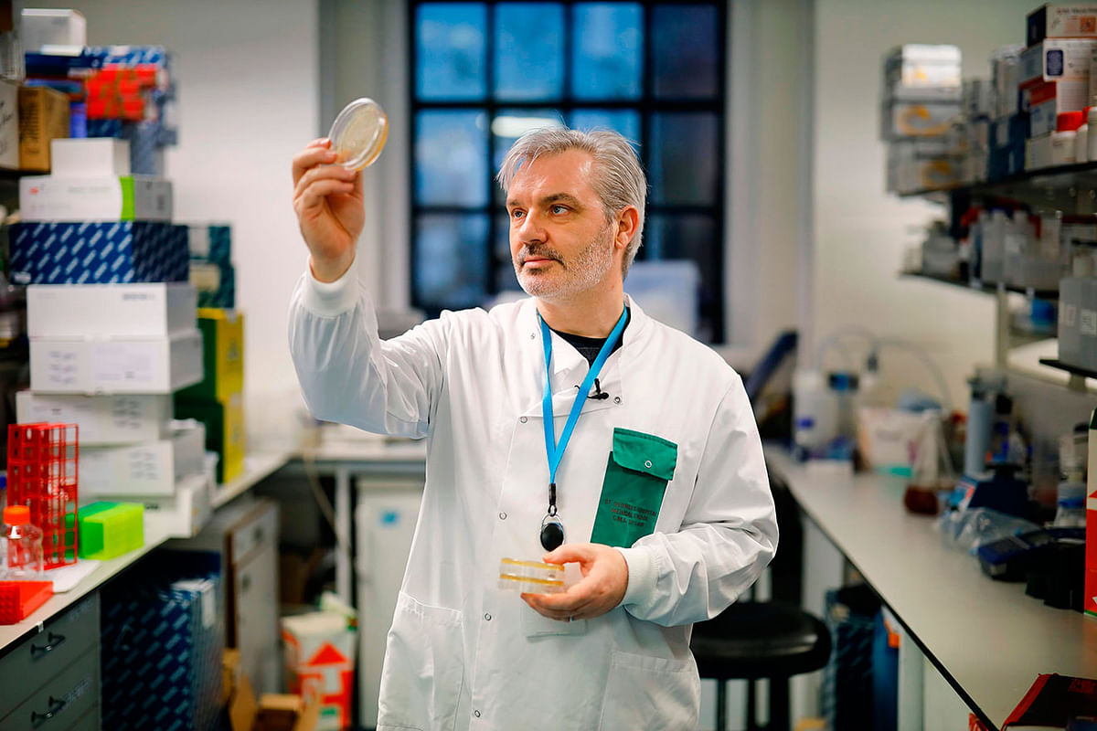 Doctor Paul McKay, who is working on an vaccine for the 2019-nCoV strain of the novel coronavirus, poses for a photograph with bacteria containing fragments of coronavirus DNA, at Imperial College School of Medicine (ICSM) in London on 10 February 2020. Photo: AFP