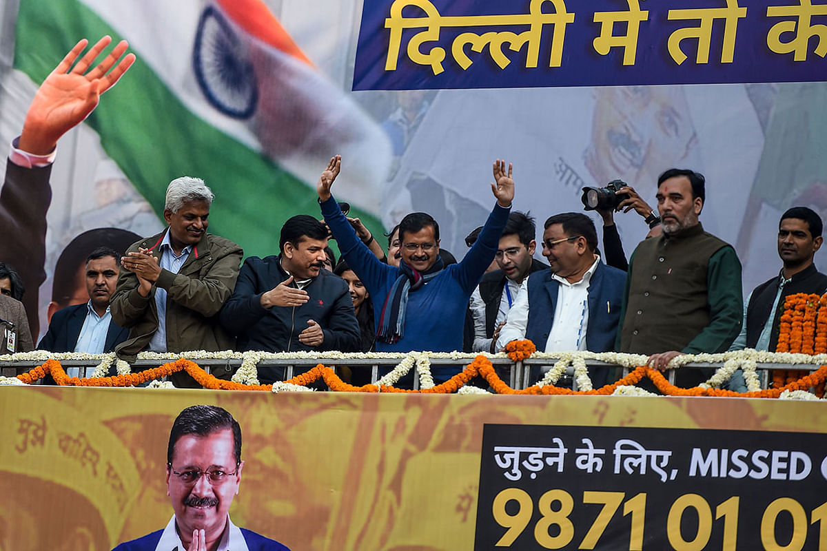 Aam Aadmi Party (AAP) chief Arvind Kejriwal (C) gestures towards his supporters at the party headquarters in New Delhi on 11 February 2020. Photo: AFP