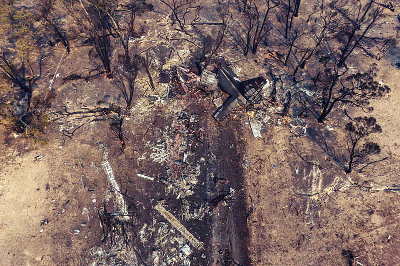 Debris seen following the crash of a C-130 air tanker plane after dropping fire retardant, in this January 24, 2020 picture obtained from social media, in Snowy Mountains, New South Wales, Australia. Photo: Reuters