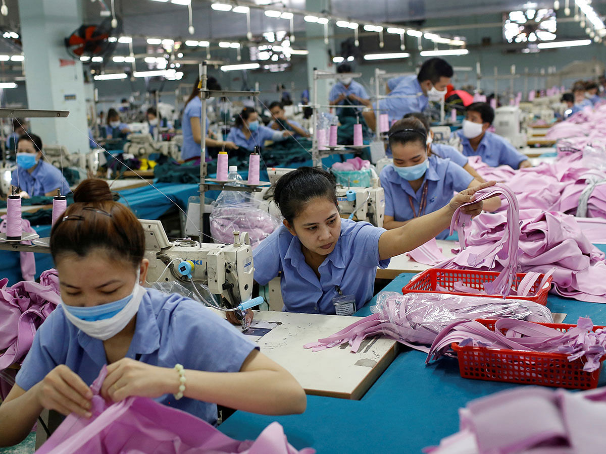 Labourers work at a garment assembly line of Thanh Cong textile, garment, investment and trading company in Ho Chi Minh city, Vietnam on 9 July 2019. Reuters File Photo