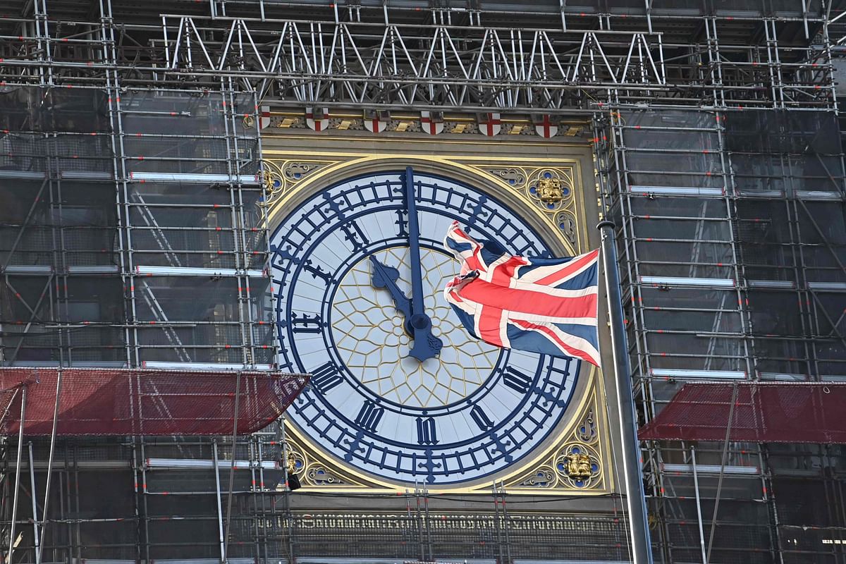 In this file photo taken on January 28, 2020 The clock face of Elizabeth Tower, known after the bell Big Ben, shows the hands at eleven o`clock as a Union Flag flies in front of it in London on 28 January 2020. Photo: AFP