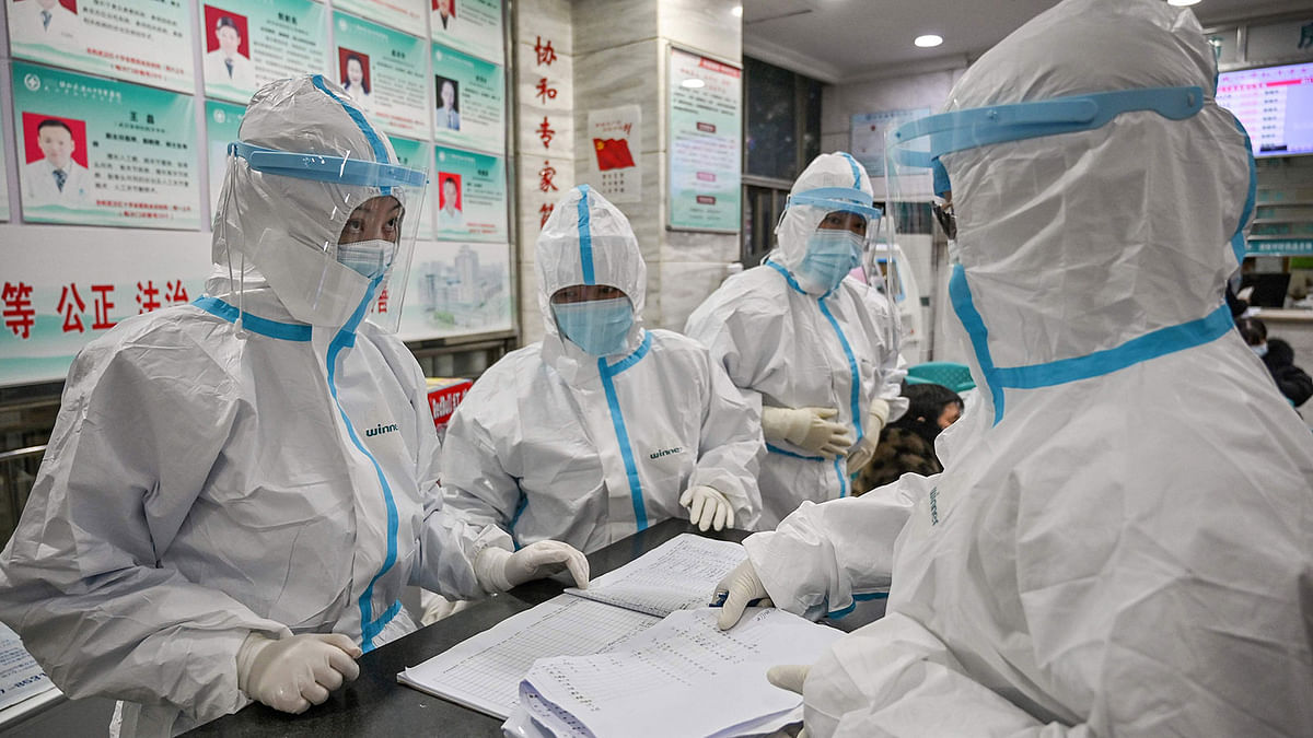 This file photo taken on 25 January 2020 shows medical staff members wearing protective clothing to help stop the spread of a deadly virus which began in the city as they work at the Wuhan Red Cross Hospital in Wuhan. Photo: AFP