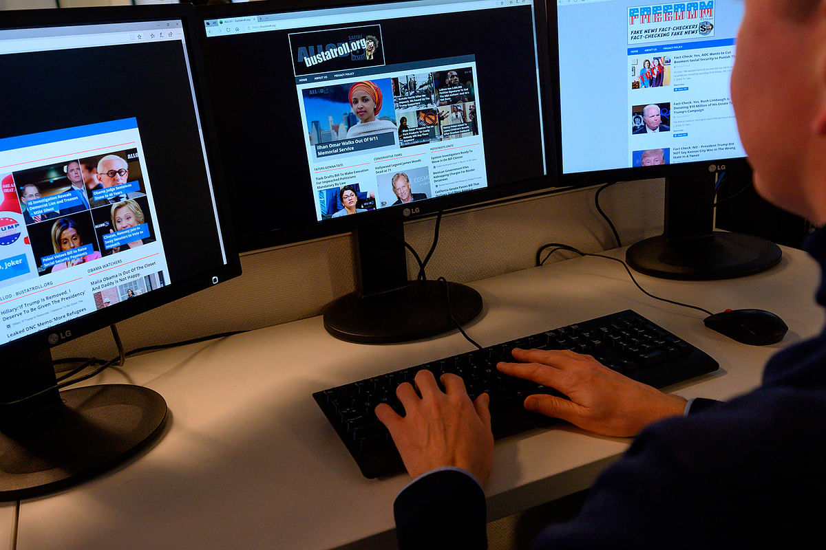 An AFP journalist looks at websites that are part of Christopher Blair`s `America`s Last Line of Defense` network in Washington DC on 13 February 2020. Photo: AFP
