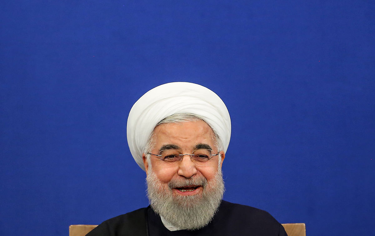 Iranian president Hassan Rouhani smiles as he speaks during a news conference in the capital Tehran, on 16 February. Photo: AFP