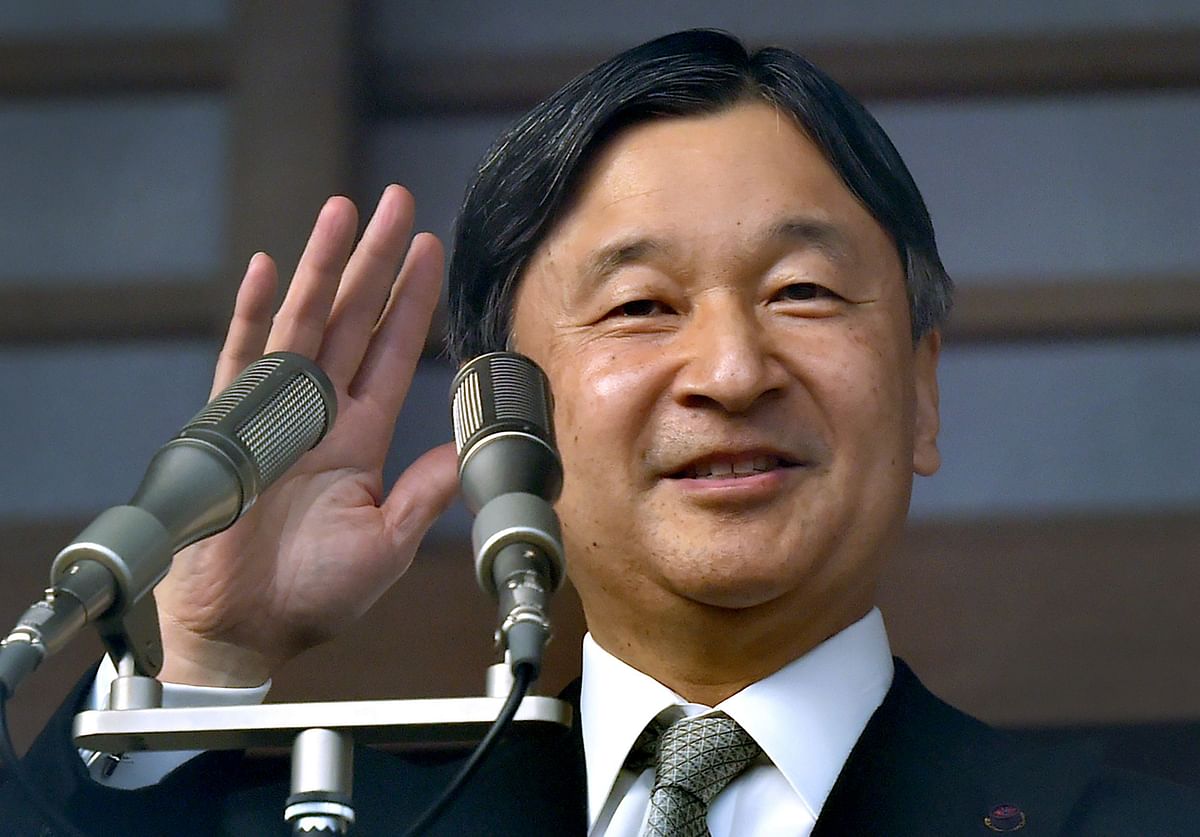 This file photo taken on 2 January shows Japan`s emperor Naruhito waving to well-wishers during a New Year`s greeting ceremony at the Imperial Palace in Tokyo. Photo: AFP