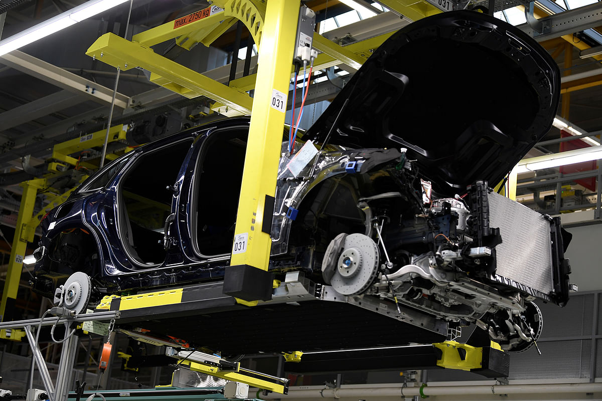 A battery cell is installed at a Mercedes-Benz EQC electric car in a production line at a plant in Bremen .Photo: Reuters