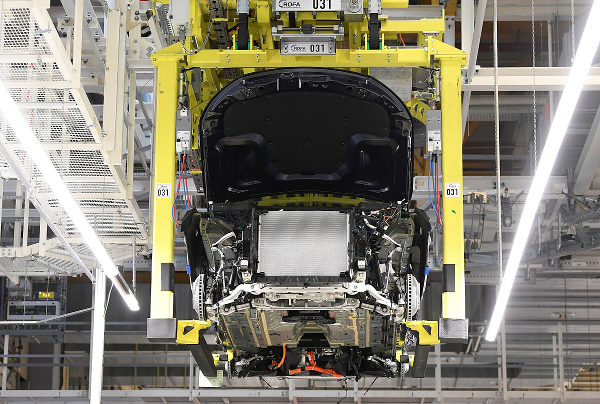 A battery cell is installed at a Mercedes-Benz EQC electric car in a production line at a plant in Bremen. Photo: Reuters