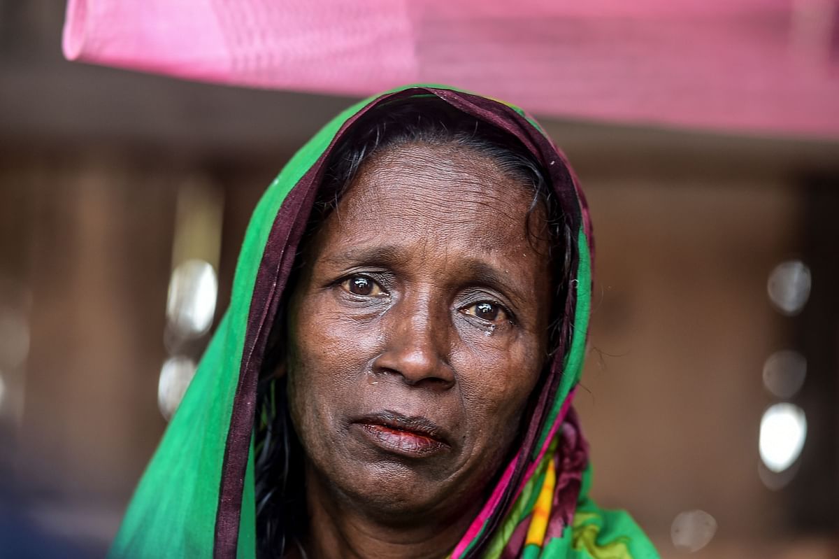 In this photograph taken on 11 November, 2019, Bangladeshi mother-of-four Mosammat Rashida, whose husband was killed by a Bengal tiger a decade ago while he was collecting honey, reacts as she speaks during an interview with AFP at her house in Shyamnagar. Photo: AFP