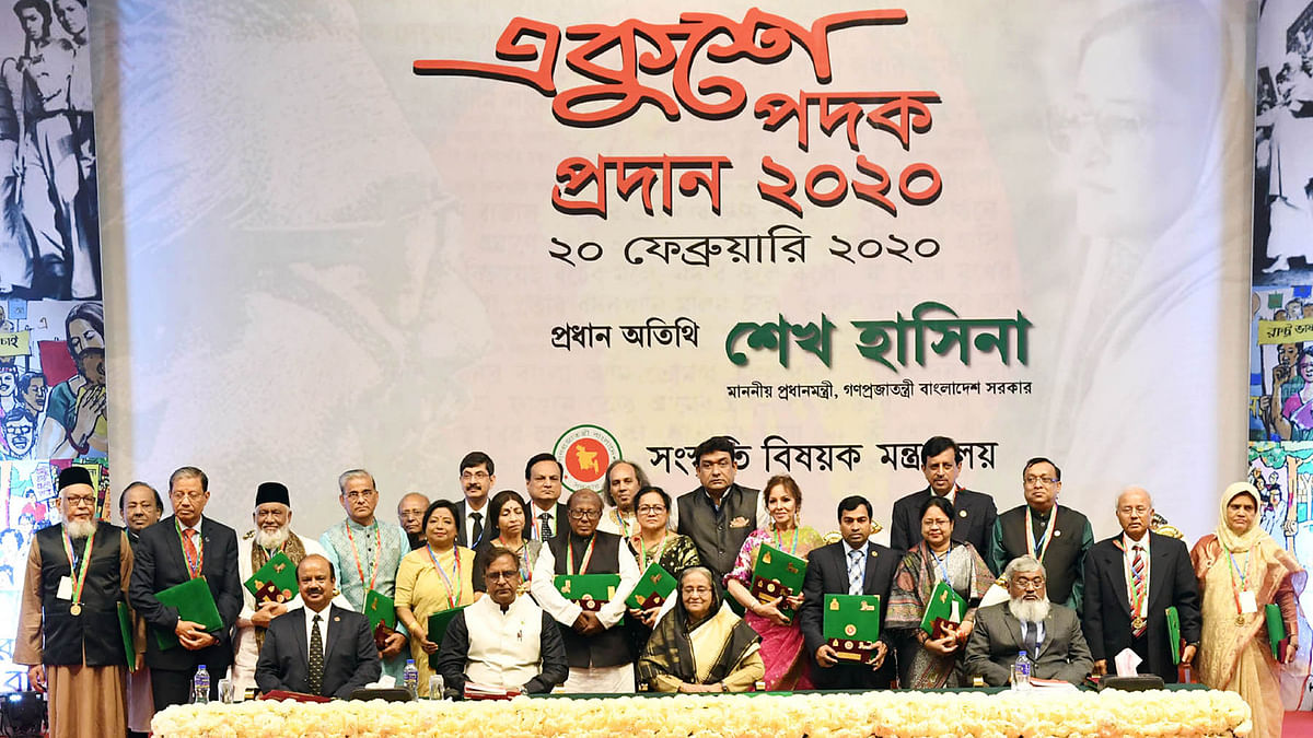Prime minister Sheikh Hasina poses for a photo session with the awardees of prestigious `Ekushey Padak-2020` at Osmani Memorial Auditorium, Dhaka on 20 February 2020. Photo: PID