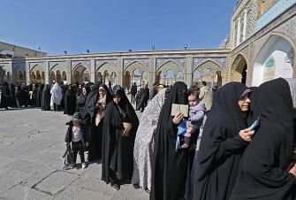 Iranians queue up to vote during parliamentary elections at the Shah Abdul Azim shrine on the southern outskirts of Tehran on 21 February 2020. Iranians began voting in a parliamentary election which conservatives are expected to dominate, capitalising on public anger against moderate conservative President Hassan Rouhani over a ravaged economy, corruption and multiple crises. Photo: AFP