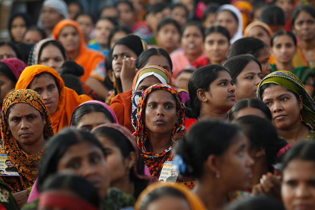Garment workers listen to speakers during a rally demanding an increase to their minimum wage in Dhaka 21 September, 2013. Photo: Reuters