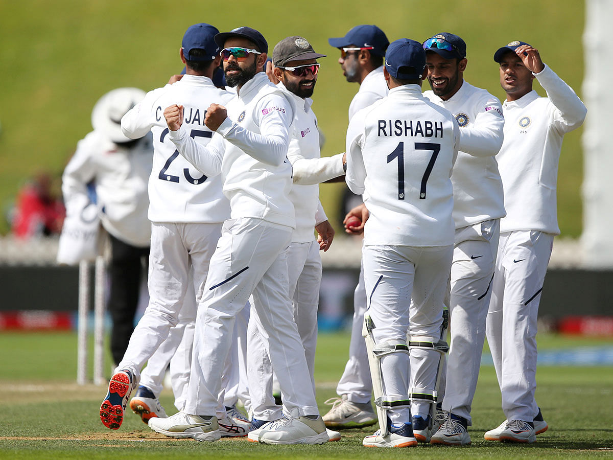 India captain Virat Kohli celebrates the wicket of New Zealand`s BJ Watling with teammates in the First Test at Basin Reserve, Wellington, New Zealand on 23 February 2020. Photo: Reuters