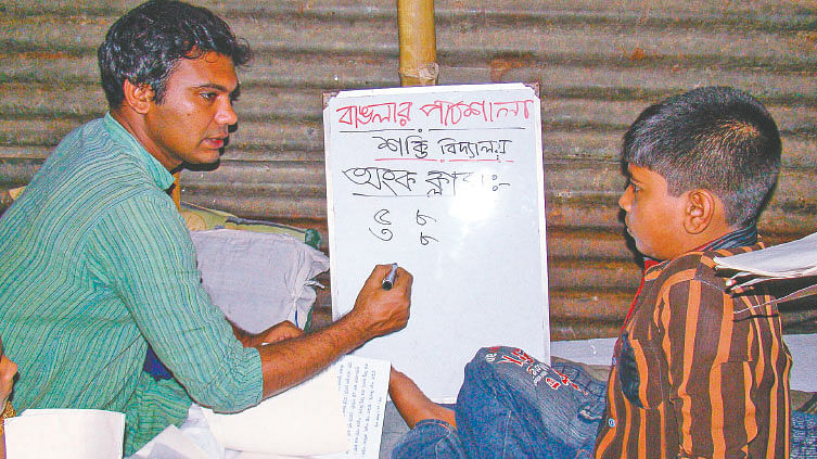 This little room was spared by the slum dwellers for Ahmed Javed Chowdhury’s teaching