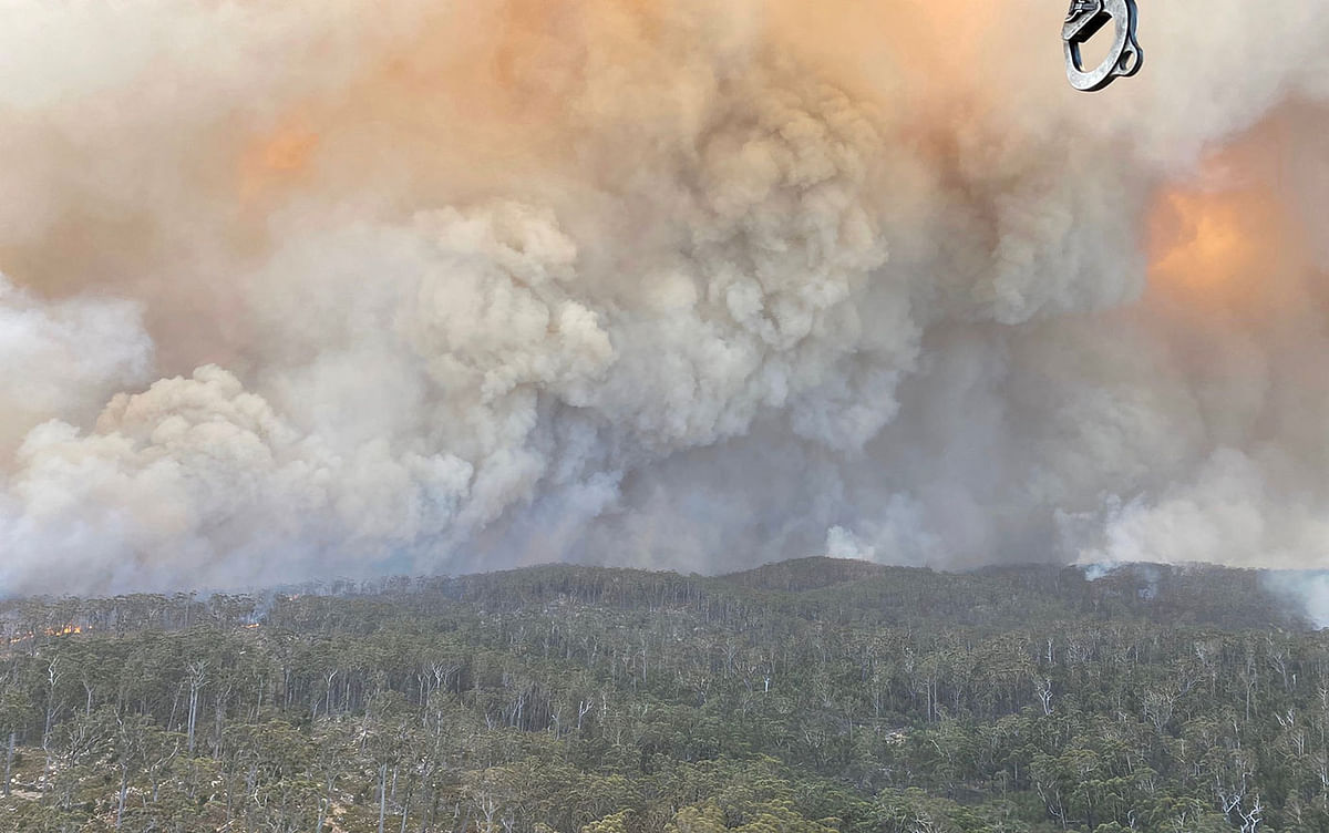Smoke rises as the Big Jack Mountain fire spreads in Bega Valley, New South Wales. Photo: Reuters