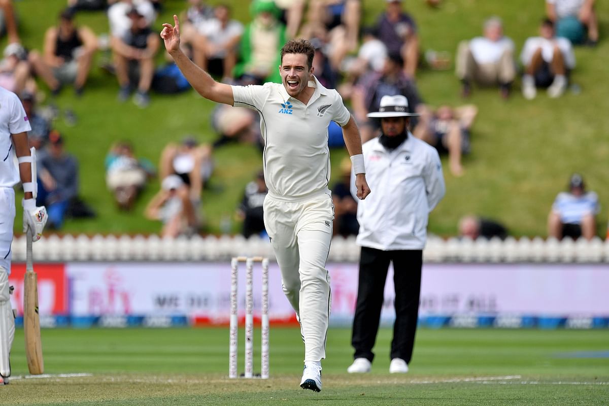 New Zealand`s Tim Southee celebrates India`s Ajinkya Rahane being caught during day two of the first Test cricket match between New Zealand and India at the Basin Reserve in Wellington on 22 February, 2020. Photo: AFP