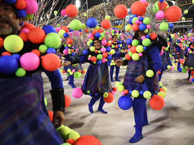 Members of the Estacio de Sa samba school perform during the first night of carnival parade at the Sambadrome in Rio de Janeiro, Brazil on 23 February. Photo: AFP