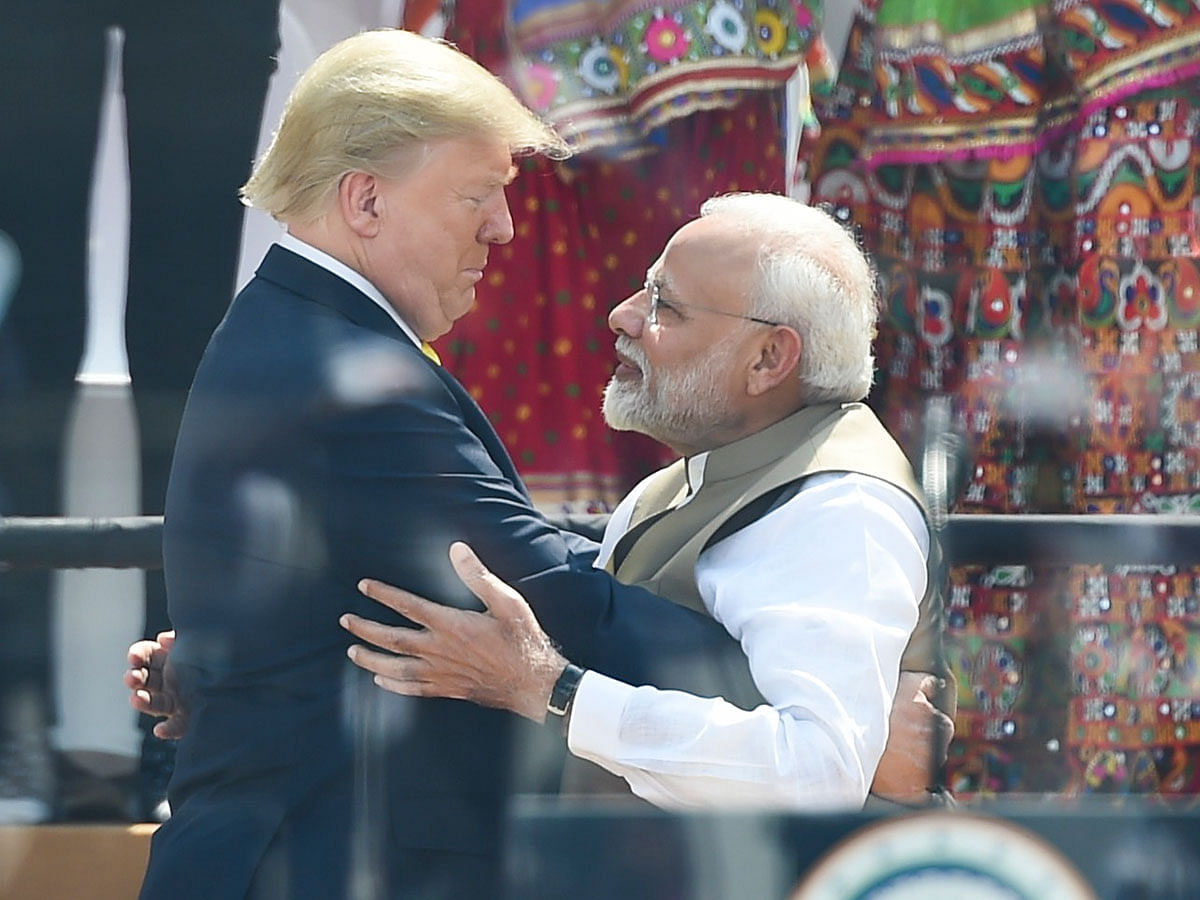 US President Donald Trump (L) embraces India`s Prime Minister Narendra Modi during `Namaste Trump Rally` at Sardar Patel Stadium in Motera, on the outskirts of Ahmedabad, on 24 February 2020. Photo: AFP