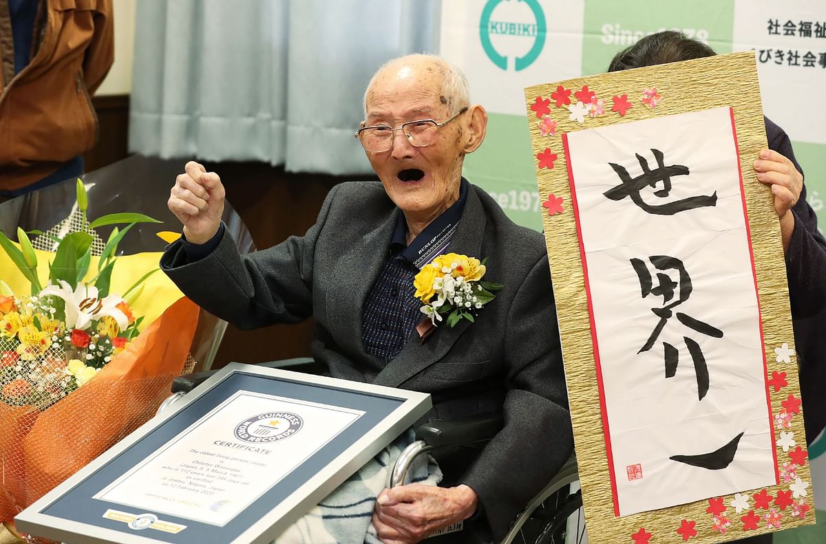 In this Japan Pool picture received via Jiji Press on 12 February, 2020, 112-year-old Japanese man Chitetsu Watanabe poses next to calligraphy reading in Japanese `World Number One` after he was awarded as the world`s oldest living male in Joetsu, Niigata prefecture. A Japanese man recently named the world`s oldest living male has died Photo: AFP