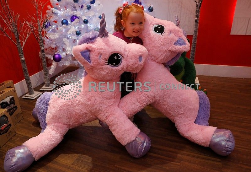 Aston Robertson-Jeyes, aged 3, plays with Unice Unicorn, at the launch of Hamleys top Christmas toys launch in London, Britain on 26 September. Photo:AFP