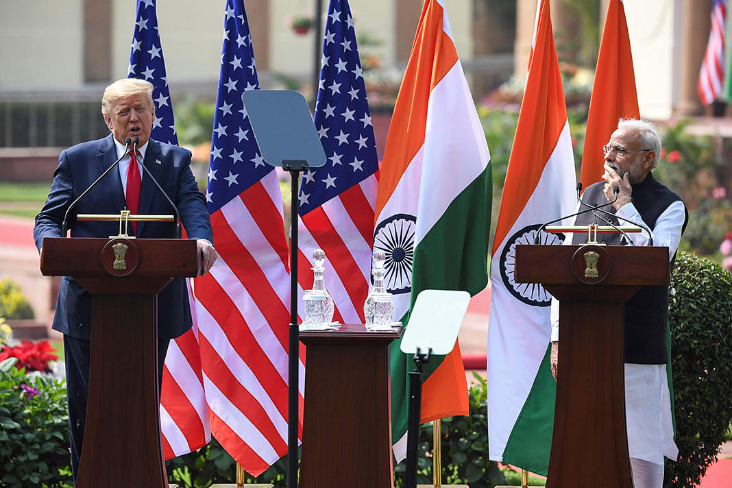 US president Donald Trump (L) speaks as India`s Prime Minister Narendra Modi listens during a joint press conference at Hyderabad House in New Delhi on 25 February 2020. Photo: AFP