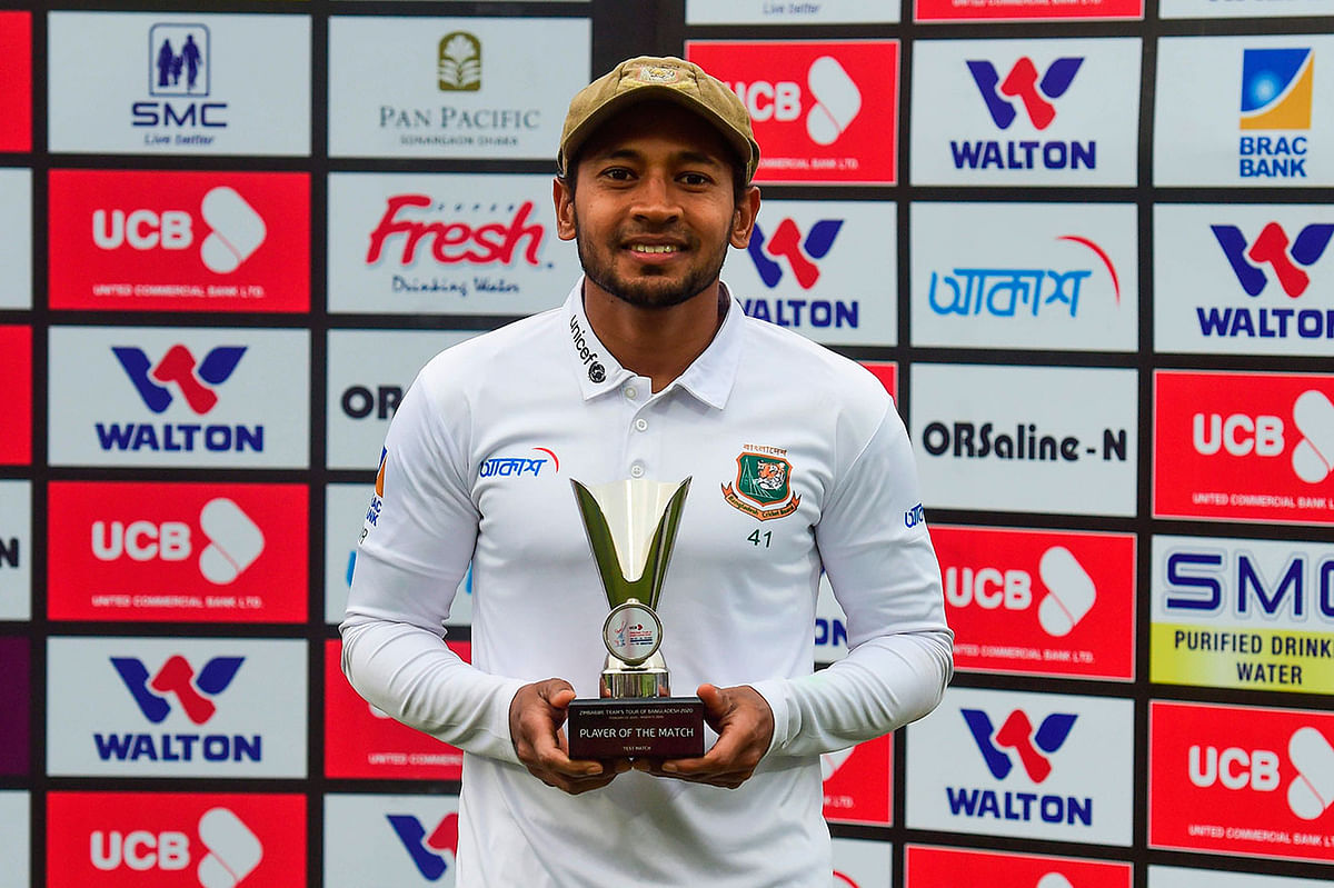 Bangladesh`s Mushfiqur Rahim poses for a photo with the Man of the Match trophy following a presentation ceremony after winning the test match between Bangladesh and Zimbabwe during the fourth day at the Sher-e-Bangla National Cricket Stadium in Dhaka on 25 February 2020. Photo: AFP